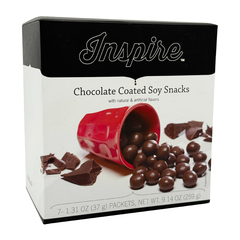 A red cup spills chocolate-coated soy snacks onto a white background, with chocolate pieces scattered nearby, showcasing the product titled "Inspire Chocolate Coated Soy Snacks."