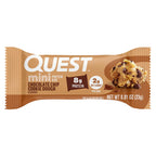 A chocolate chip cookie dough flavored protein bar wrapper displays the brand name "Quest," highlighting 8g of protein and 2g of net carbs per 0.81 oz bar, with a cookie dough image beside it.