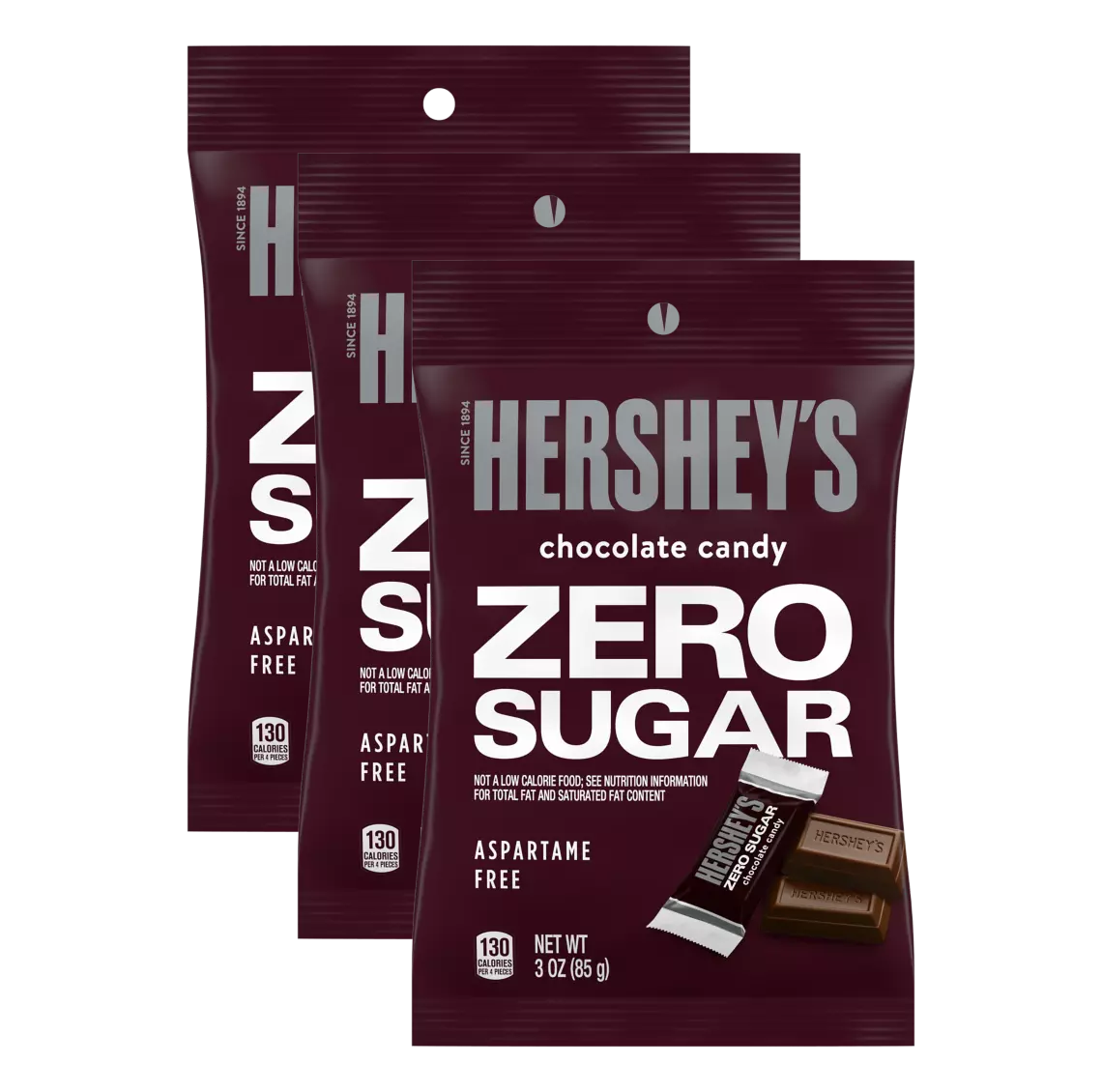Three packages of Hershey's Zero Sugar chocolate candy are displayed, featuring bold white text on a maroon background, highlighting that they are aspartame-free and contain 130 calories per serving.