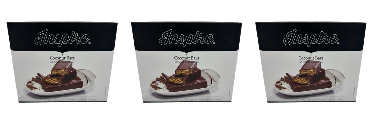Three boxes of Inspire Coconut Bars, featuring a chocolate coating and coconut filling, each containing seven 1.55 oz bars, with a total net weight of 10.86 oz.