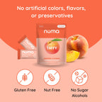 Numa Peaches 'n Cream pouch, wrapped taffies, and fresh peach