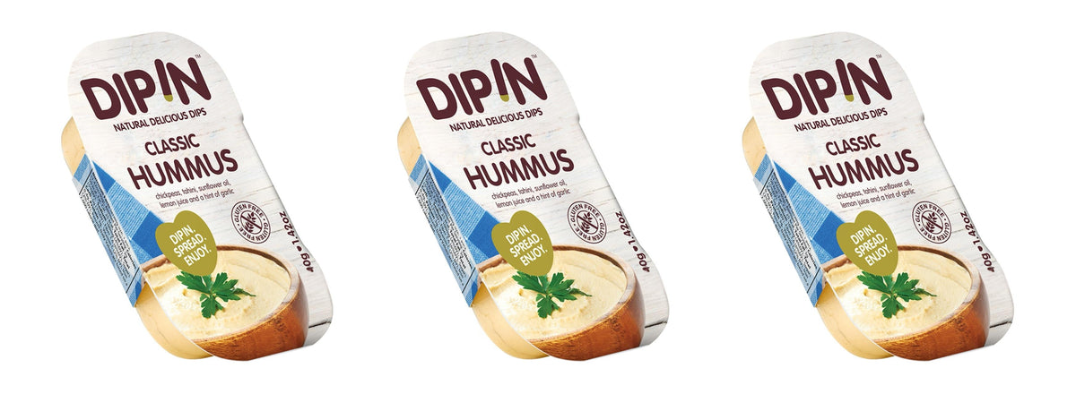Three containers of DIP IN Classic Hummus are displayed, each featuring a light wooden background, a bowl of hummus topped with parsley, and text highlighting ingredients and serving suggestions.