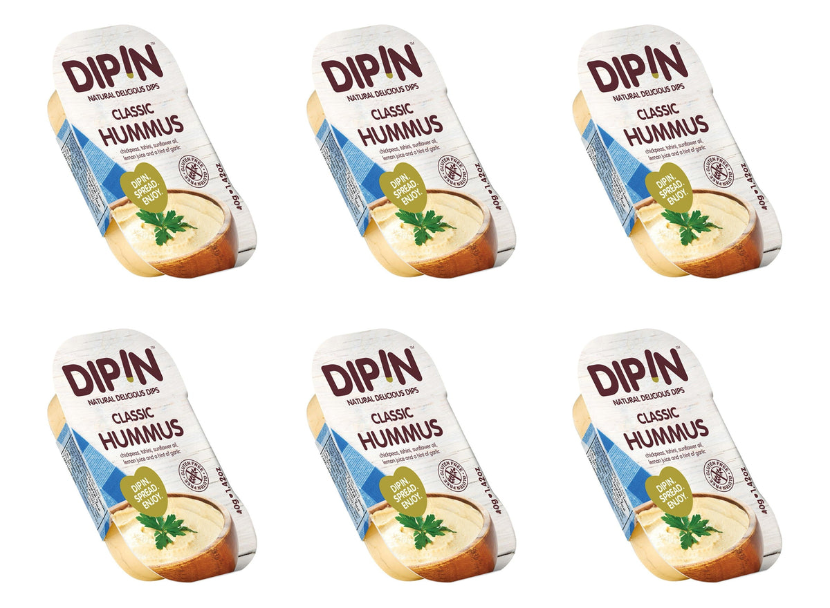 Six containers of DIP IN Classic Hummus are arranged in a grid, each featuring a wooden bowl of hummus topped with a sprig of parsley and a label highlighting its natural ingredients.