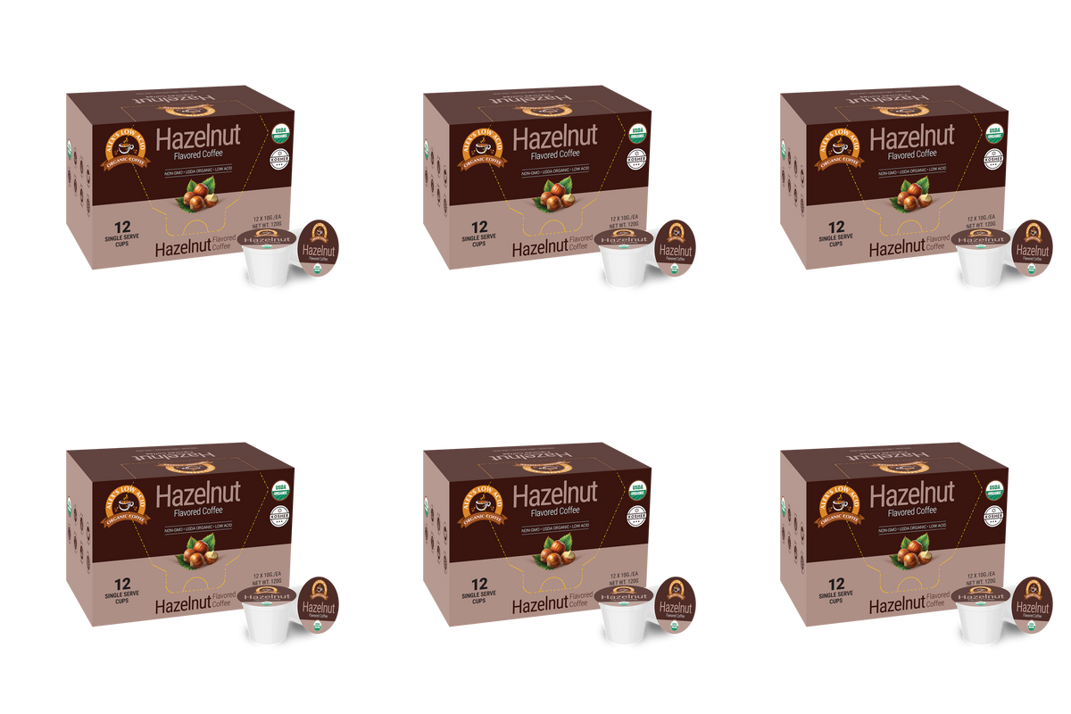 Six boxes of Hazelnut flavored coffee, each containing 12 single-serve cups, are displayed against a plain background, highlighting the product's branding and organic certification.