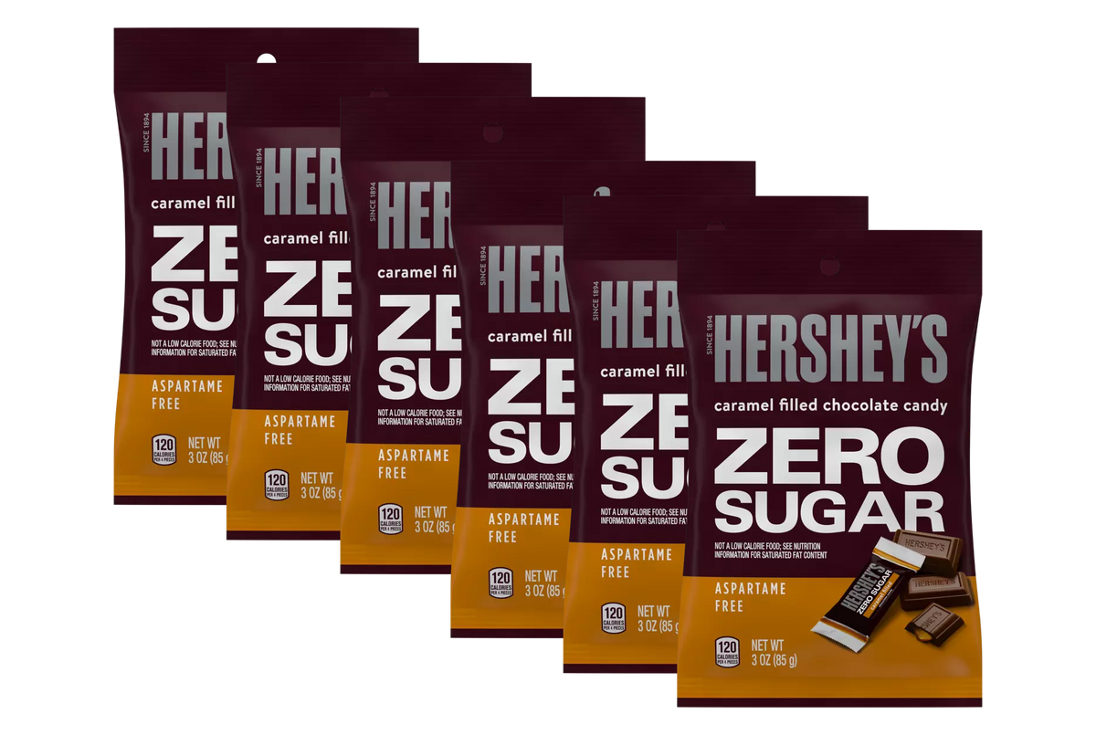 Six packages of Hershey's Zero Sugar caramel-filled chocolate candy are displayed, each labeled with the product name and details, emphasizing that they are aspartame-free and weigh 3 ounces.