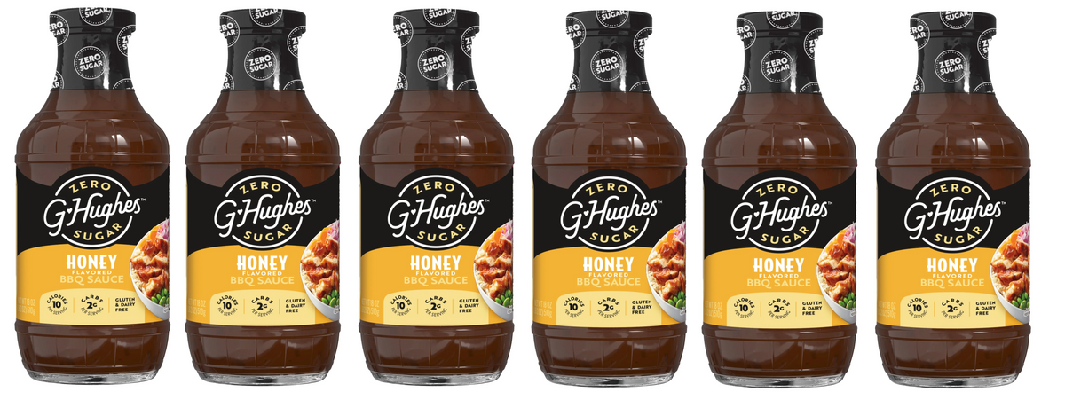 Six bottles of G. Hughes Honey Flavored BBQ Sauce are lined up, each featuring a label that highlights "Zero Sugar," "Gluten & Dairy Free," and nutritional information on a yellow background.