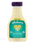 A clear bottle of Wholesome Allulose sweetener with a purple cap, labeled as non-GMO and zero calories, features a heart design and states it is keto certified, weighing 11.5 ounces.