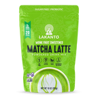 Bright green packaging of Lakanto Monk Fruit Sweetened Matcha Latte powdered drink mix features a decorative design, product name, and highlights like sugar-free, vegan, and probiotic benefits.
