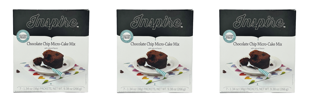 Three boxes of Inspire Chocolate Chip Micro-Cake Mix are displayed, each featuring a slice of cake on a plate with a fork, set against a colorful heart-patterned napkin.