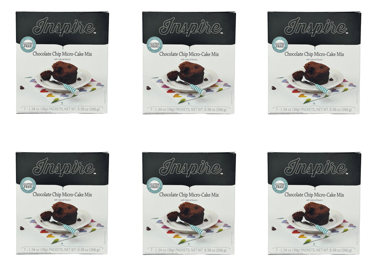 Six boxes of Inspire Chocolate Chip Micro-Cake Mix are displayed, each featuring a slice of cake on a plate with a fork, set against a colorful, heart-patterned napkin.