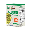 A green box of Explore Cuisine Organic Edamame & Mung Bean Fettuccine displays a bowl of the pasta, highlighting its high protein content and simple ingredients, with nutrition facts on the side.