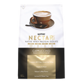 A brown cup of cappuccino sits on a saucer, with a packet of Syntrax Nectar Whey Protein Isolate in cappuccino flavor displayed, highlighting its protein content and instant mix features.