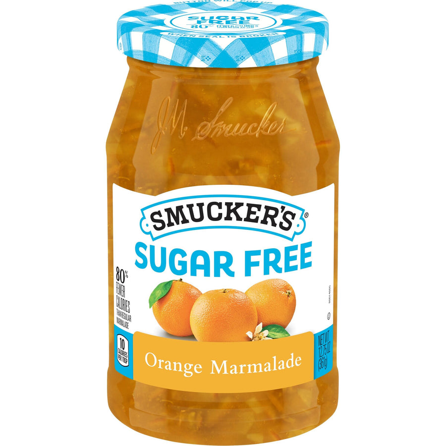 A jar of Smucker's Sugar Free Orange Marmalade, featuring a blue and white checkered lid, displays whole oranges on the label and highlights its low-calorie content.
