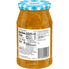 A clear glass jar of sugar-free orange marmalade with a blue and white checkered lid, displaying the nutrition facts and ingredients on the label, sits against a plain background.