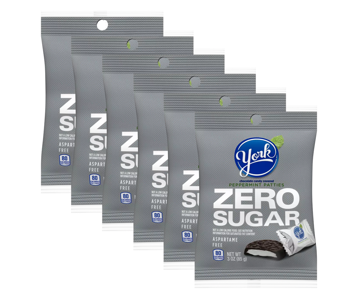Six packages of York Zero Sugar Peppermint Patties are displayed, featuring a gray design with blue and white text, highlighting that they are aspartame-free and contain 80 calories per serving.