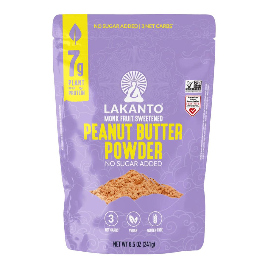 A purple bag of Lakanto Monk Fruit Sweetened Peanut Butter Powder, featuring bold yellow text, highlights its no sugar added, vegan, and gluten-free attributes, with 7 grams of plant-based protein per serving.