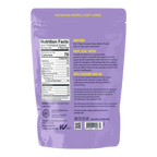 The back of a purple packaging for Lakanto Peanut Butter Powder displays nutrition facts, directions for use, and a brief history about monk fruit, emphasizing its health benefits and zero sugar content.