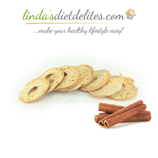 Linda's Diet Delites cinnamon bagel chips beside cinnamon sticks.