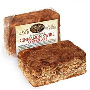 A piece of Scrumptious Cinnamon Swirl Coffeecake beside its wrapper.