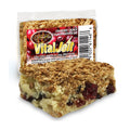 A Scrumptious VitalJolt Cranberry Crunch Collagen Brownie Bar beside its wrapper.