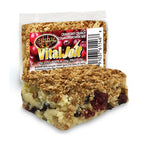 A Scrumptious VitalJolt Cranberry Crunch Collagen Brownie Bar beside its wrapper.