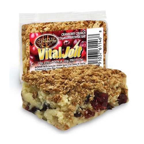 A Scrumptious VitalJolt Cranberry Crunch Collagen Brownie Bar beside its wrapper.