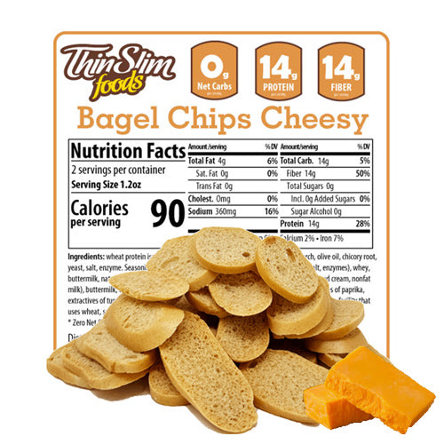 ThinSlim Foods Cheesy Bagel Chips label behind bagel chips and pieces of cheese.