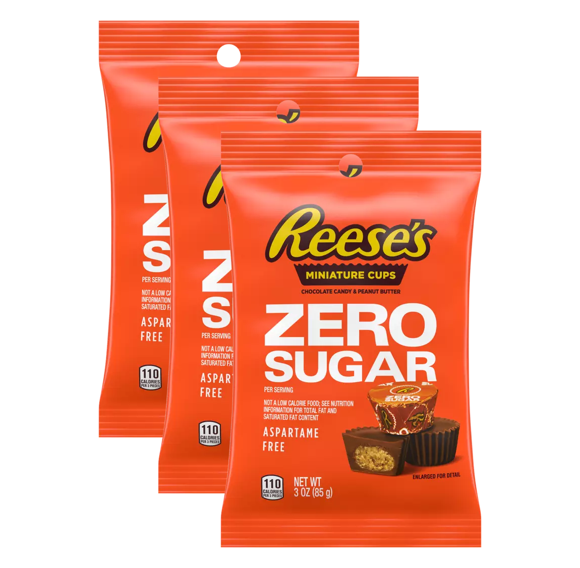 Three packages of Reese's Miniature Cups, labeled "Zero Sugar," feature bright orange packaging with nutritional information and images of the candy, emphasizing it's aspartame-free and 110 calories per serving.