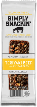 A packaged snack featuring a teriyaki beef jerky bar with pineapple pieces, labeled "Simply Snackin'," highlighting its gluten-free and grass-fed beef qualities.