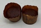 Two ThinSlim Foods chocolate Cloud Cakes in brown paper baking cups.