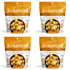 Four bags of Ashapops popped water lily seeds are displayed, featuring a turmeric garlic flavor, with each bag showing a bowl of the crunchy snack and highlighting its vegan and low-calorie attributes.